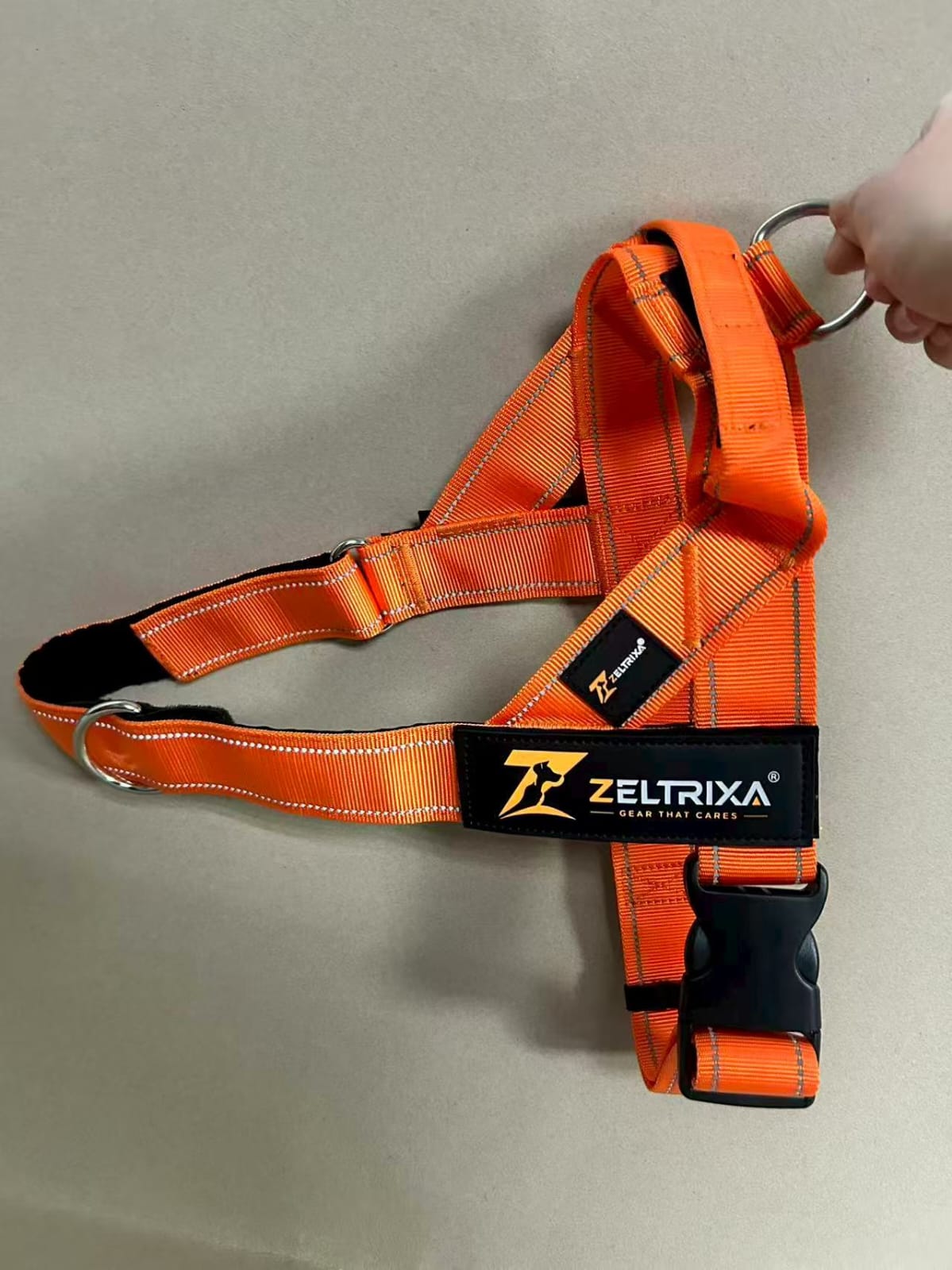Close-up of the Zeltrixa branded chest panel and reflective webbing